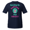 Running On Sarcasm And Snacks funny T-shirt with colorful cartoon character and playful typography on a white shirt
