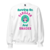 Running On Sarcasm And Snacks funny sweatshirt with colorful cartoon character and playful pink and teal typography
